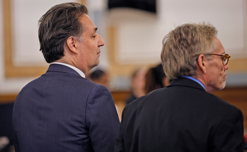 Brian Walshe, left, and lawyer Larry Tipton listen as the jury is polled about their guilty verdict of the first degree murder of his wife Ana in 2023 by a Norfolk Superior Court jury in Dedham, Mass., on Monday Dec. 15, 2025. (Greg Derr/The Patriot Ledger via AP, Pool)