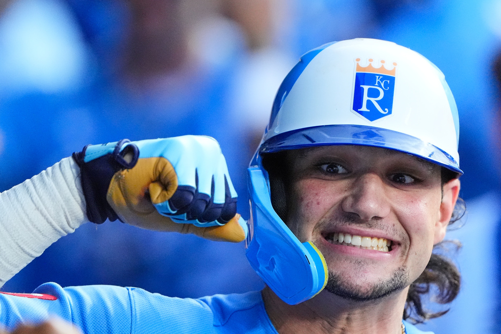 Kansas City Royals' Jac Caglianone celebrates in the dugout after hitting a two-run home run during the seventh inning of a baseball game against the Chicago Cubs, Saturday, Aug. 8, 2026, in Kansas City, Mo. (AP Photo/Charlie Riedel)