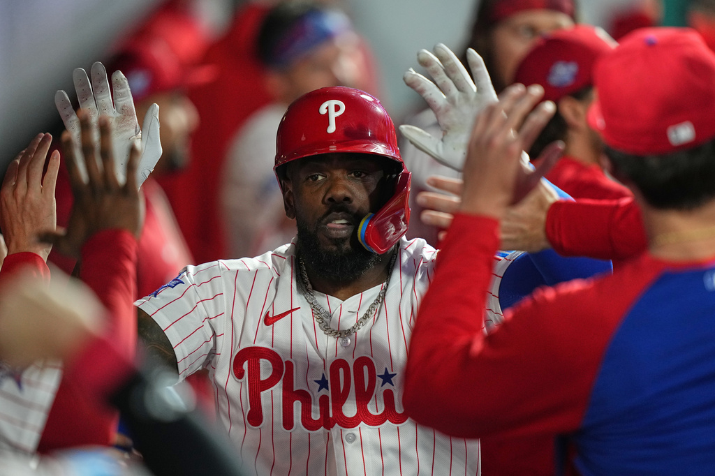 Philadelphia Phillies' Adolis García celebrates his home run off of Athletics pitcher Jeffrey Springs during the sixth inning of a baseball game, Wednesday, May 6, 2026, in Philadelphia. (AP Photo/Matt Rourke)