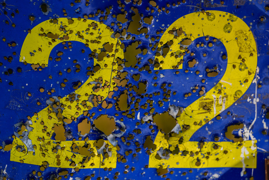 A steel shooting target is peppered with gunshot holes at the ski base in Chernihiv, Ukraine, Thursday, Oct. 30, 2025. (AP Photo/Julia Demaree Nikhinson)