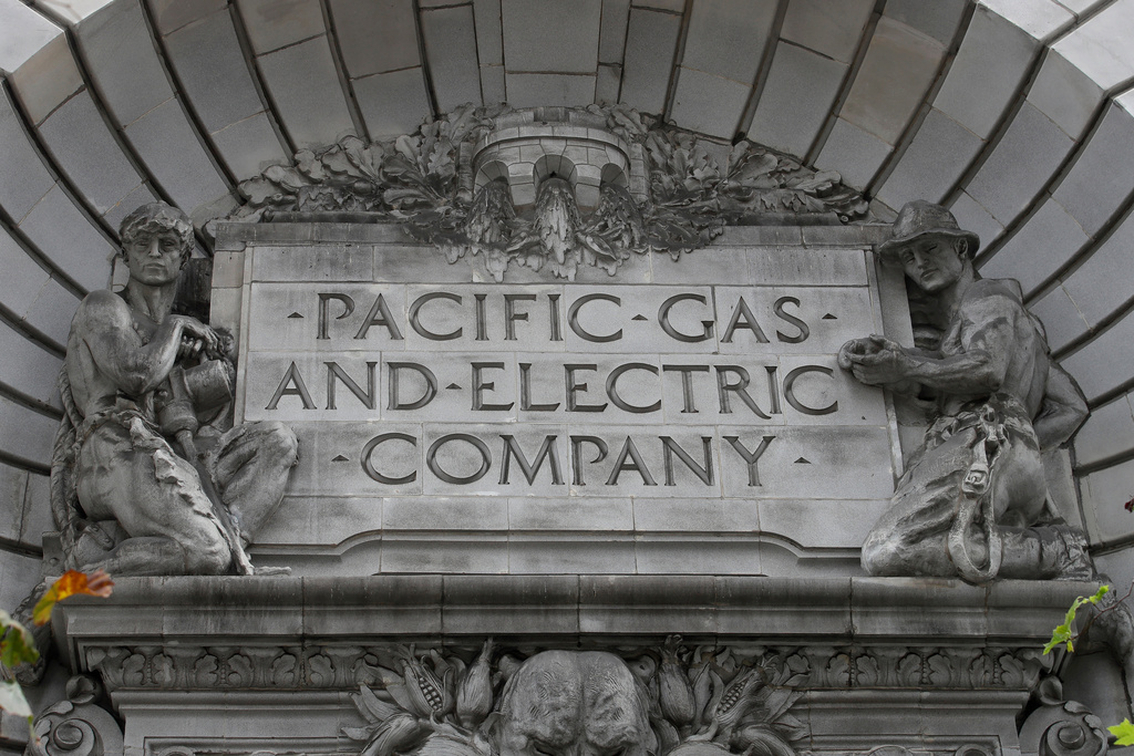 FILE - A Pacific Gas & Electric sign is displayed on the exterior of a PG&E building in San Francisco on April 16, 2020. (AP Photo/Jeff Chiu, File)