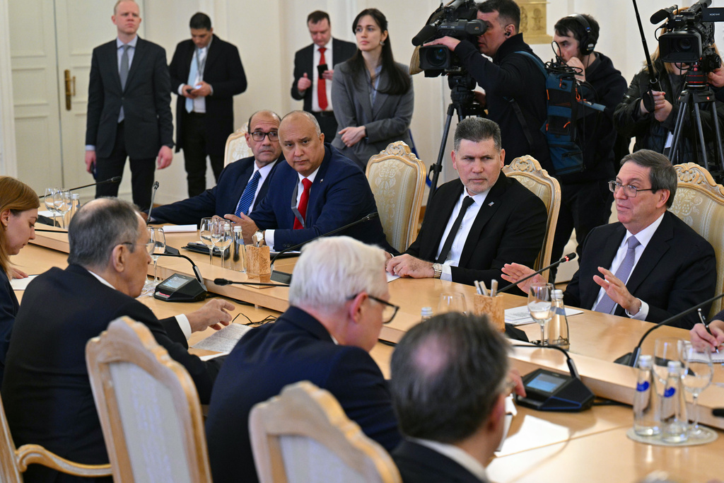 Russian Foreign Minister Sergey Lavrov, 2nd left, meets with Cuban Foreign Minister Bruno Rodriguez, right, in Moscow, Russia, Wednesday, Feb. 18, 2026. (Hector Retamal/Pool Photo via AP)