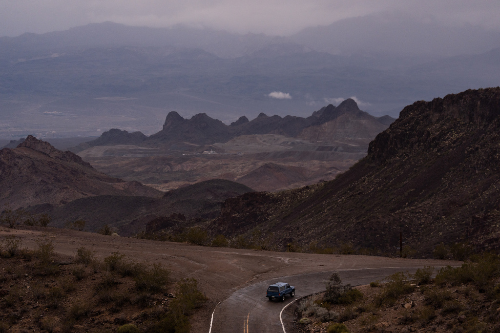 FILE - A car drives along Oatman Highway on historic Route 66, near Oatman, Ariz., on Friday, Nov. 21, 2025. (AP Photo/Jae C. Hong, File)