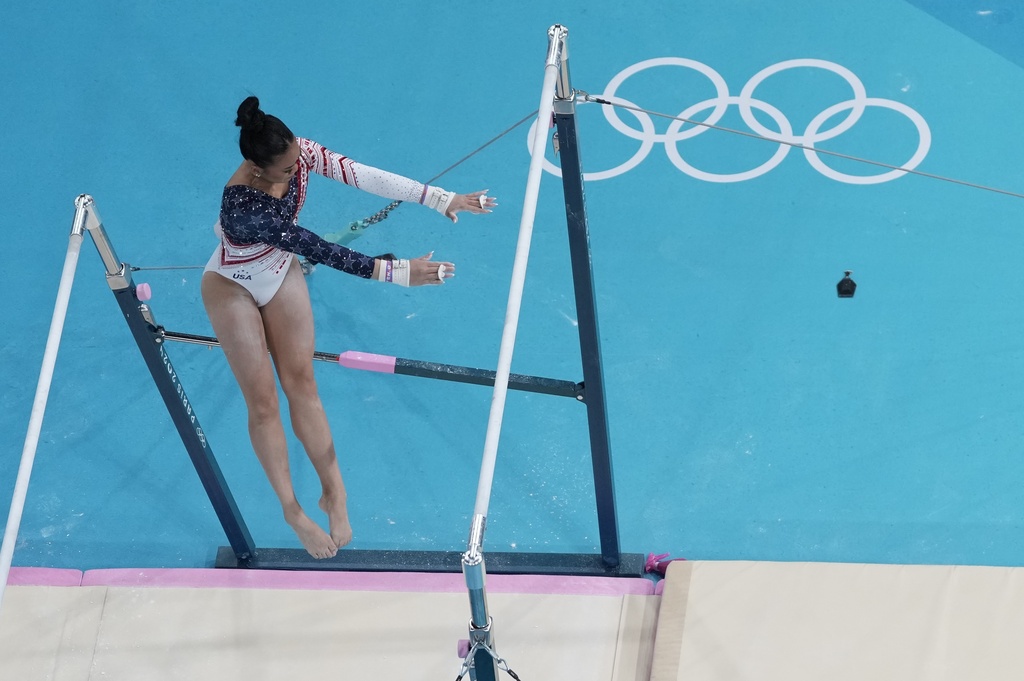 Sunisa Lee, of United States, performs on the uneven bars during the women's artistic gymnastics team finals at the 2024 Summer Olympics, Tuesday, July 30, 2024, in Paris, France. (AP Photo/Morry Gash)