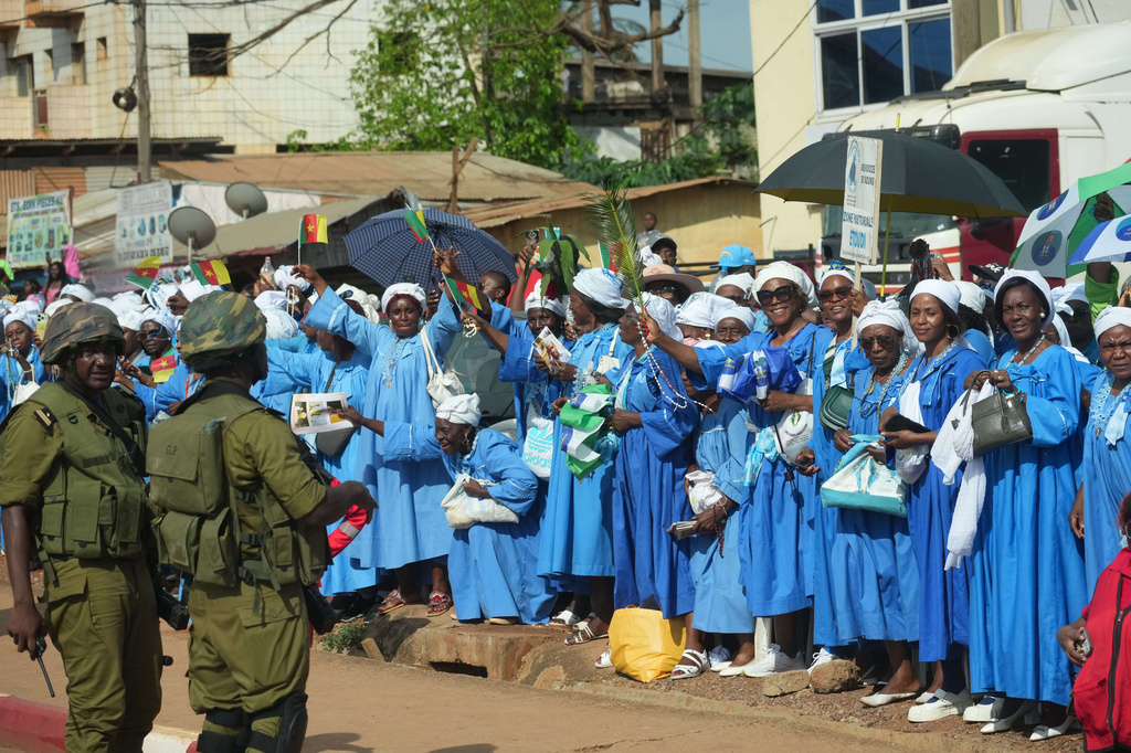 People greet Pope Leo XIV upon his arrival in Yaounde, Cameroon, Wednesday, April 15, 2026, on the third day of an 11-day apostolic journey to Africa. (AP Photo/Andrew Medichini)