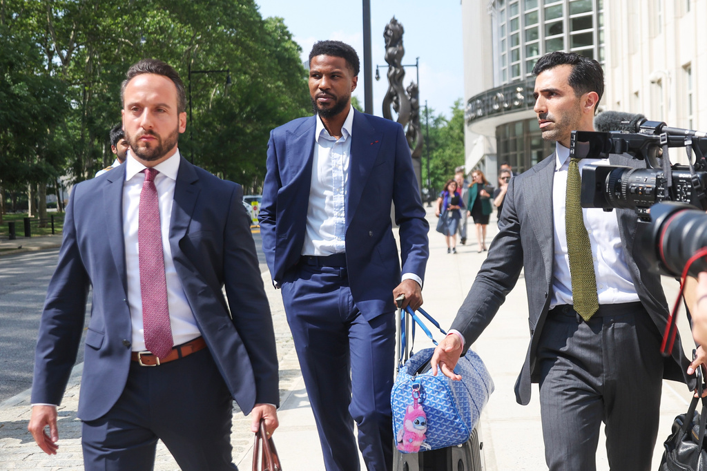 Former NBA player Malik Beasley, center, exits Brooklyn federal court, Wednesday, July 1, 2026, in New York. (AP Photo/Heather Khalifa) CORRECTION: name of the photographer corrected to Heather Khalifa instead of Yuki Iwamura
