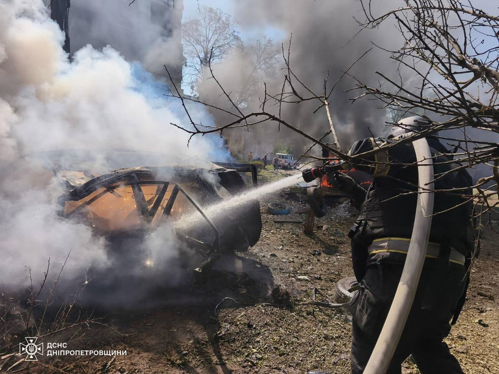 In this photo provided by the Ukrainian Emergency Service, firefighters put out a fire following a Russian air attack in Pavlohrad, Dnipropetrovsk region, Ukraine, Monday, July 20, 2026. (Ukrainian Emergency Service via AP)