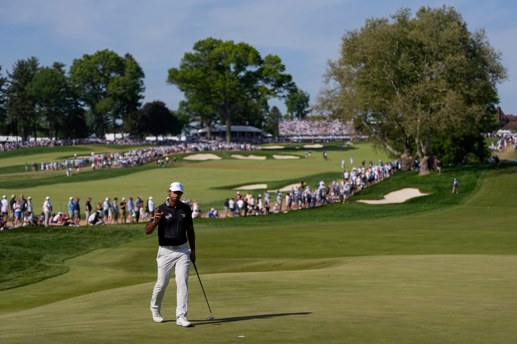 Aaron Rai, of England, waves on the 10th green during the final round of the PGA Championship golf tournament at Aronimink Golf Club, Sunday, May 17, 2026, in Newtown Square, PA. (AP Photo/Matt Slocum)