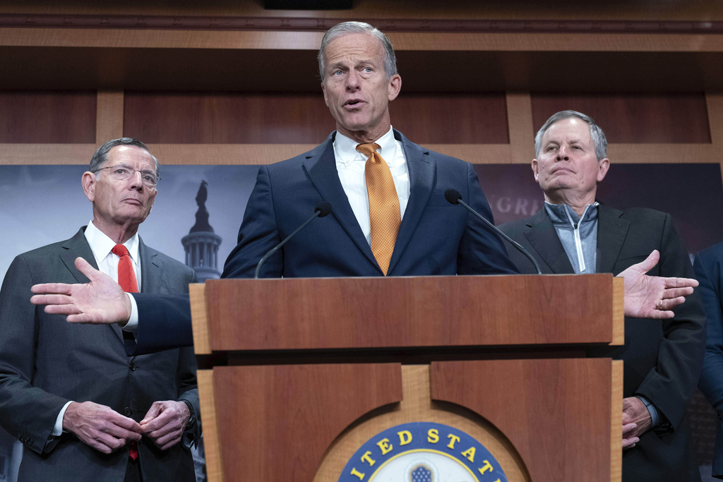 Senate Majority Leader John Thune, R-S.D., flanked by Sen. John Barrasso, R-Wyo., left, and Sen. Steve Daines, R-Mont., speaks during a news conference on Capitol Hill in Washington, Friday, Sept. 19, 2025. (AP Photo/Jose Luis Magana)