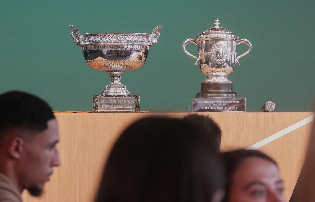 The men's, left, and women's trophies are displayed during the draw for the French Open tennis tournament, Thursday, May 21, 2026, at the Roland Garros stadium in Paris. (AP Photo/Thibault Camus)