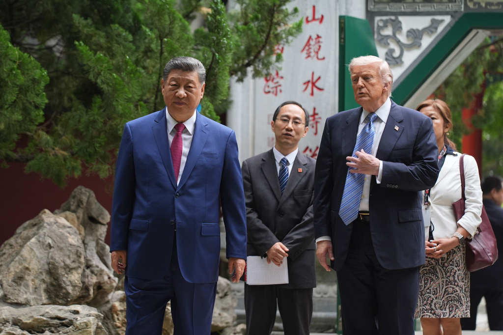 President Donald Trump talks with China's President Xi Jinping at the Zhongnanhai leadership compound, Friday, May 15, 2026, in Beijing. (AP Photo/Mark Schiefelbein, Pool)