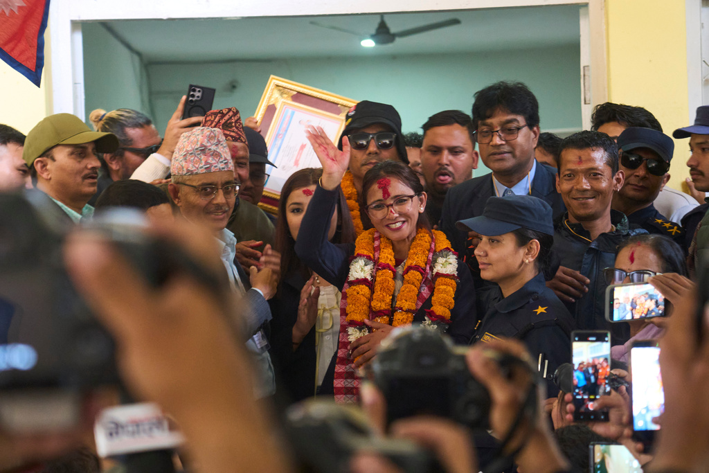Supporters of Rastriya Swatantra Party celebrate the victory of Toshima Karki, a candidate for a seat in the House of Representatives in Lalitpur, Nepal, Saturday, March 7, 2026. (AP Photo/Niranjan Shrestha)