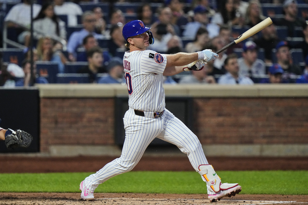 New York Mets' Pete Alonso follows through on a two-run home run during the third inning of a baseball game against the Atlanta Braves Tuesday, Aug. 12, 2025, in New York. (AP Photo/Frank Franklin II)