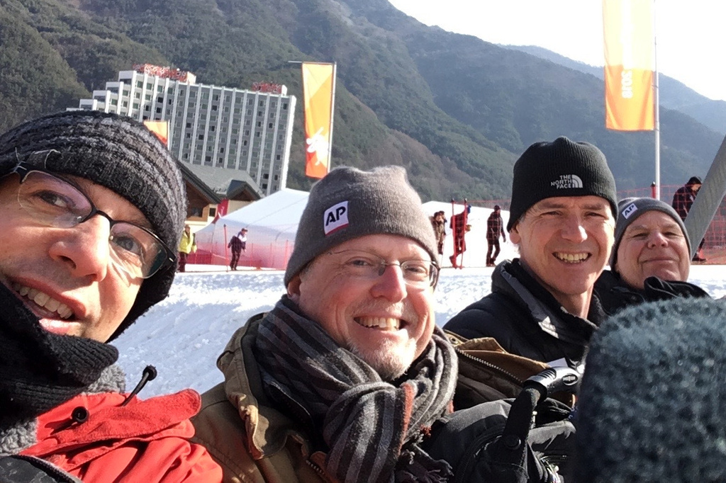 Associated Press sports reporters, from left, Howie Rumberg, Howard Fendrich, Graham Dunbar and Tim Dahlberg pose for a photo at the Winter Olympics in Pyeongchang, South Korea, on Feb. 20, 2018. (AP Photo/Howie Rumberg) CORRECTION: Dunbar, not Dunber