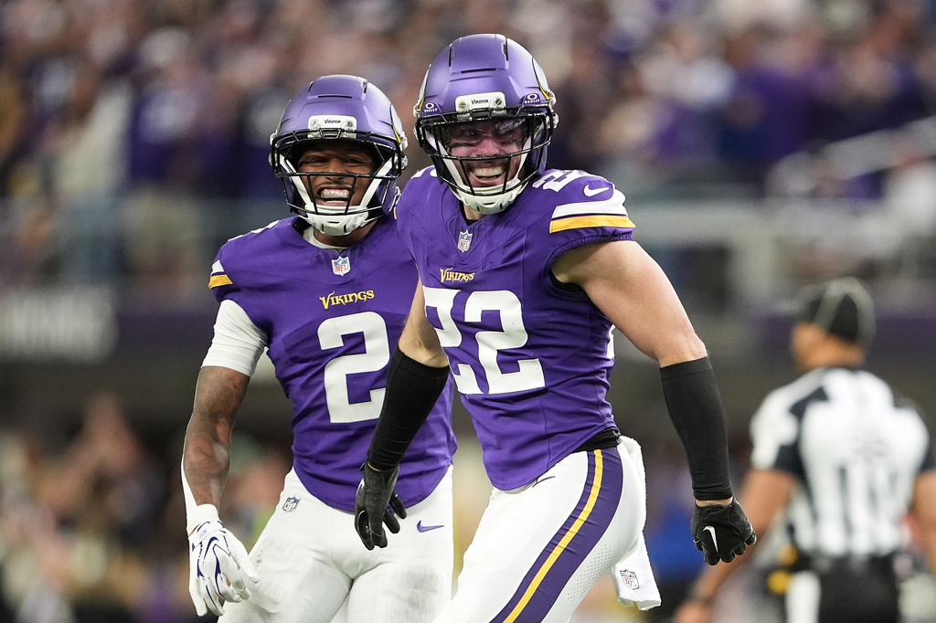 Minnesota Vikings safety Harrison Smith (22) celebrates with cornerback Isaiah Rodgers (2) after intercepting a pass against the Indianapolis Colts during the second half of an NFL football game in Minneapolis, Sunday, Oct. 25, 2026. (AP Photo/Ellen Schmidt)