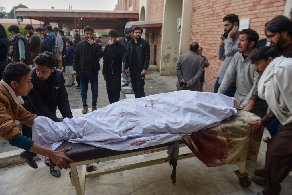 Relatives and volunteers transport a victim of bomb explosion in a Shiite mosque, from at a hospital in Islamabad, Pakistan, Friday, Feb. 6, 2026. (AP Photo/M.A Sheikh)