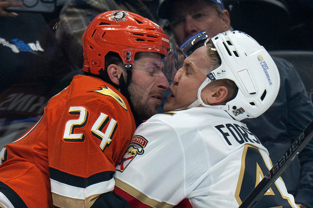 Anaheim Ducks center Jansen Harkins (24) and Florida Panthers defenseman Gustav Forsling (42) skate into each other during the first period of an NHL hockey game, Tuesday, Nov. 4, 2025, in Anaheim, Calif. (AP Photo/Kyusung Gong)
