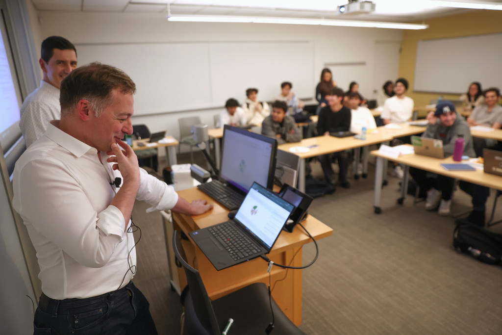 Professor Panos Ipeirotis speaks with an oral AI agent during his class at NYU Stern School of Business, March 4, 2026, in New York. (AP Photo/Heather Khalifa)
