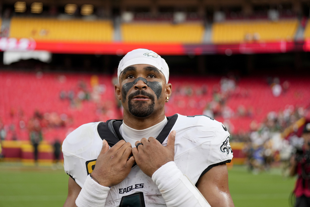 Philadelphia Eagles quarterback Jalen Hurts (1) pauses on the field following an NFL football game against the Kansas City Chiefs Sunday, Sept. 14, 2025, in Kansas City, Mo. (AP Photo/Charlie Riedel)