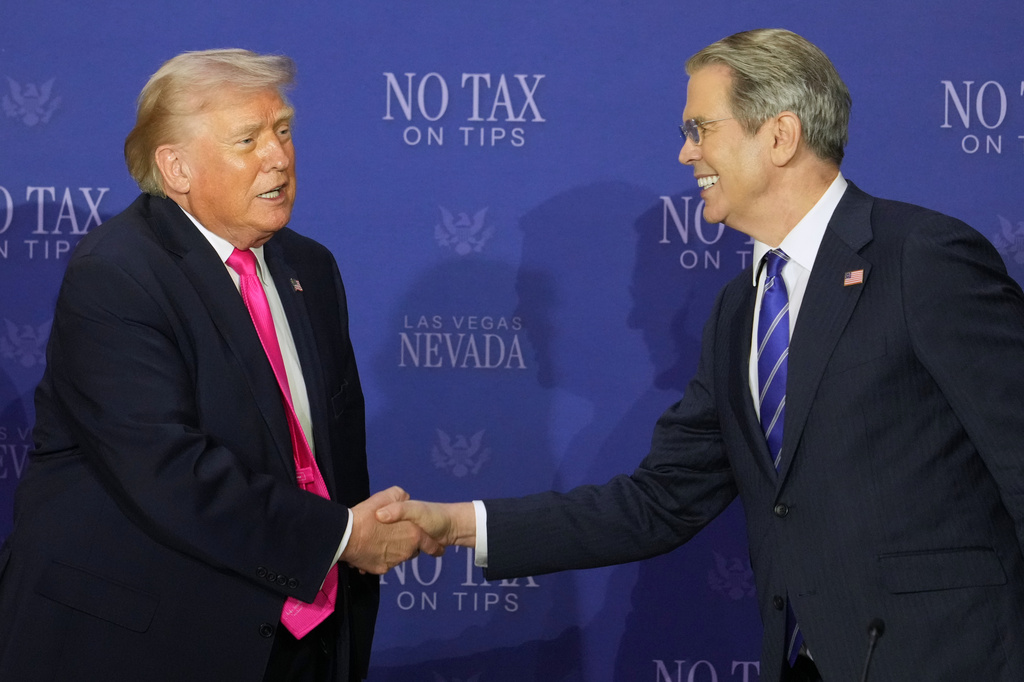 President Donald Trump shakes hands with Treasury Secretary Scott Bessent at a roundtable event about no tax on tips, Thursday, April 16, 2026, in Las Vegas. (AP Photo/Lucas Peltier)