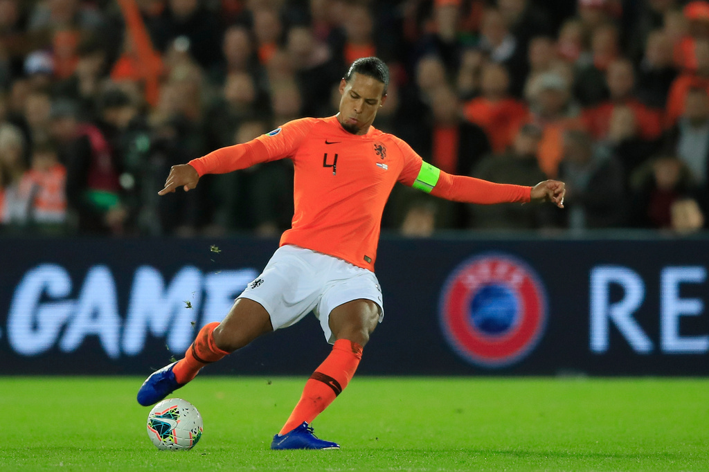 FILE - Netherlands' Virgil van Dijk passes the ball during the Euro 2020 group C qualifying soccer match between The Netherlands and Northern Ireland at De Kuip stadium in Rotterdam, Netherlands, Thursday, Oct. 10, 2019. (AP Photo/Peter Dejong, File)