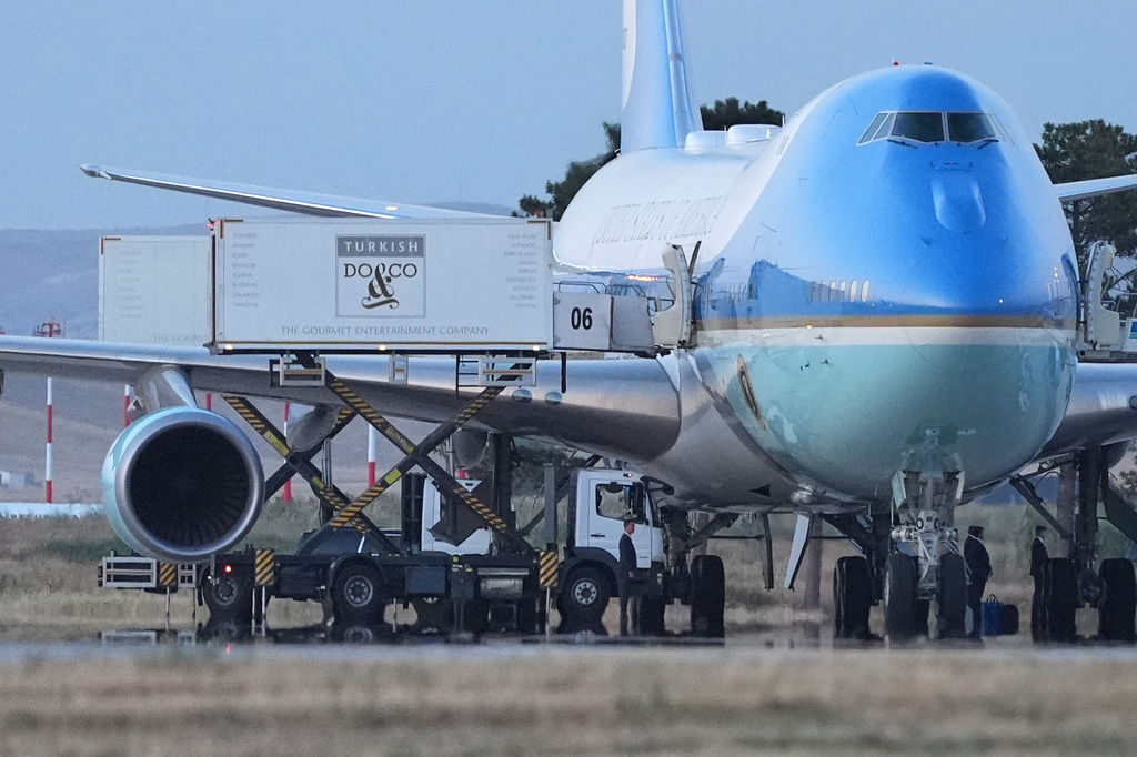 Catering trucks are parked at Air Force One on the tarmac as the motorcade carrying U.S. President Donald Trump arrives to depart following the NATO summit at Ankara International Airport in Ankara, Turkey, Wednesday, July 8, 2026. (AP Photo/Alex Brandon)