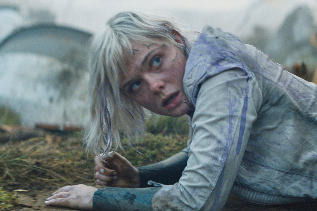 This image released by 20th Century Studios shows Elle Fanning in a scene from "Predator: Badlands." (20th Century Studios/Disney via AP)