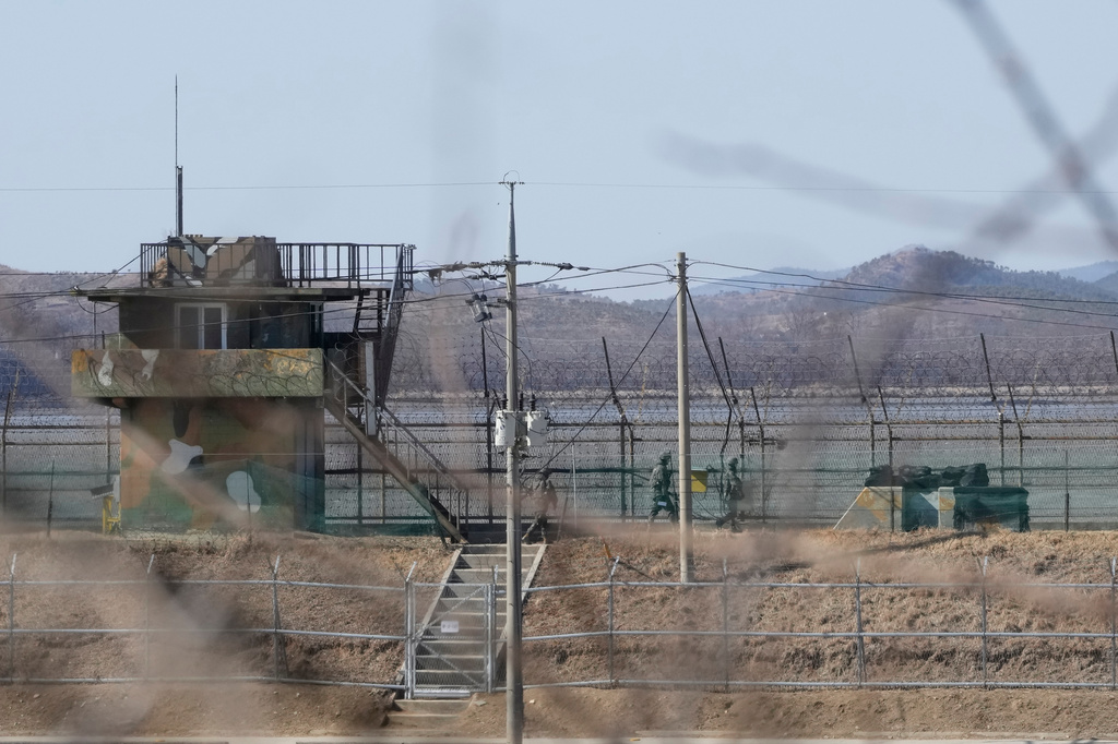 FILE - South Korean army soldiers patrol along the barbed-wire fence in Paju, South Korea, near the border with North Korea, on Feb. 18, 2025. (AP Photo/Ahn Young-joon, File)