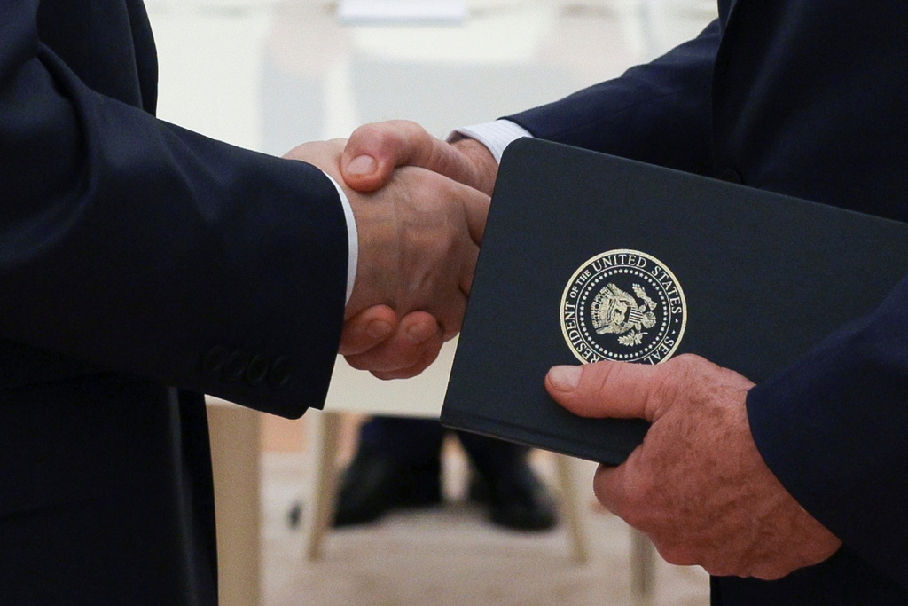 FILE - Russian President Vladimir Putin and U.S. President Donald Trump's special envoy Steve Witkoff shakes hands during their meeting at the Kremlin, in Moscow, on Aug. 6, 2025. (Gavriil Grigorov, Sputnik, Kremlin Pool Photo via AP, File)
