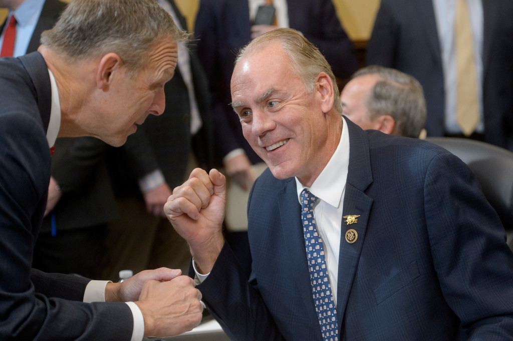 FILE - Rep. Ryan Zinke, R-Mont., right, talks with Rep. Scott Perry, R-Pa., left, prior to a House Committee on Capitol Hill, in Washington, Sept. 24, 2024. (AP Photo/Rod Lamkey, Jr., File)