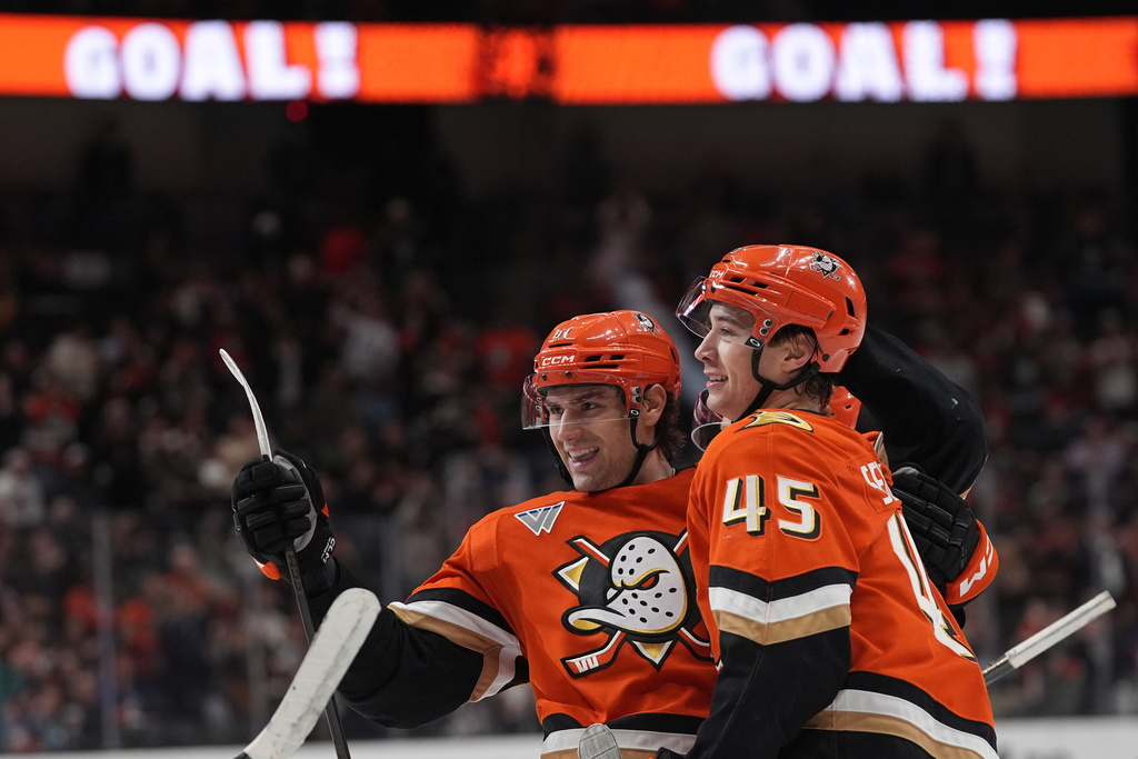 Anaheim Ducks left wing Cutter Gauthier, left, celebrates his goal with teammate right wing Beckett Sennecke during the first period of an NHL hockey game against the New York Islanders Wednesday, March 4, 2026, in Anaheim, Calif. (AP Photo/Gregory Bull)