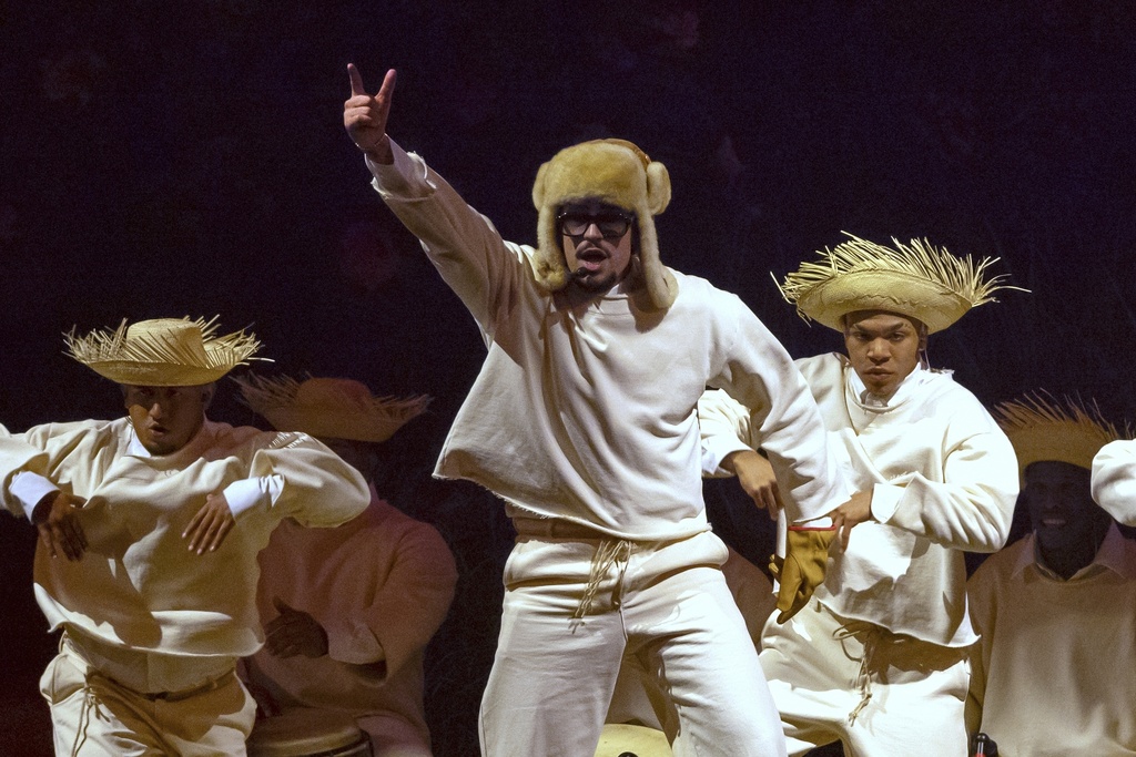Bad Bunny performs during his first show of his 30-date concert residency at the Coliseo de Puerto Rico José Miguel Agrelot, in San Juan, Puerto Rico, Friday, July 11, 2025. (AP Photo/Alejandro Granadillo)