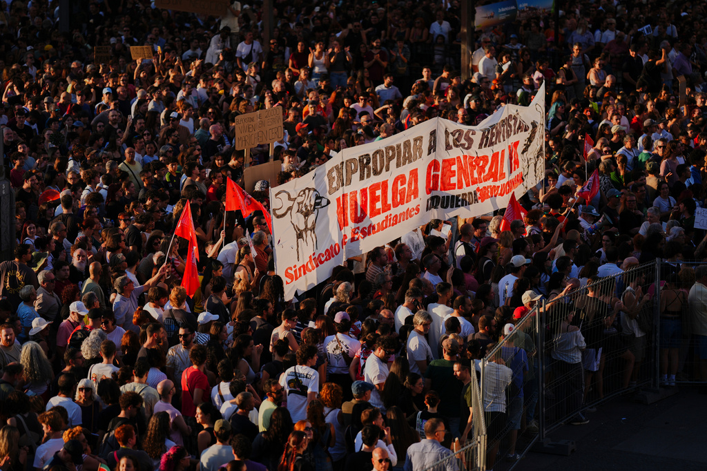 People gather during a protest following the eviction last Wednesday of 87-year-old Maricarmen to demand stronger laws to protect renters at Puerta del Sol in Madrid, Spain, Saturday, Sept. 26, 2026. (AP Photo/Manu Fernandez)