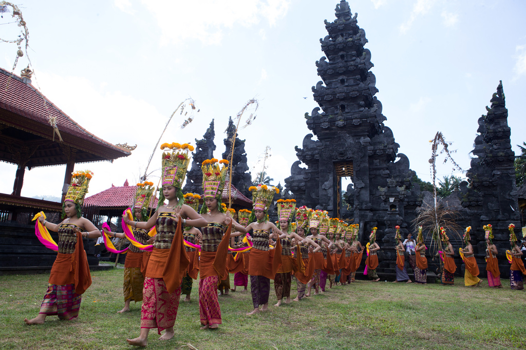 Dancers perform the sacred Rejang dance during Kuningan holiday, which marks the end of the 10-day Galungan festival celebrating the victory of good over evil, in Karangasem, Bali, Indonesia, Saturday, June 27, 2026. (AP Photo/Firdia Lisnawati)