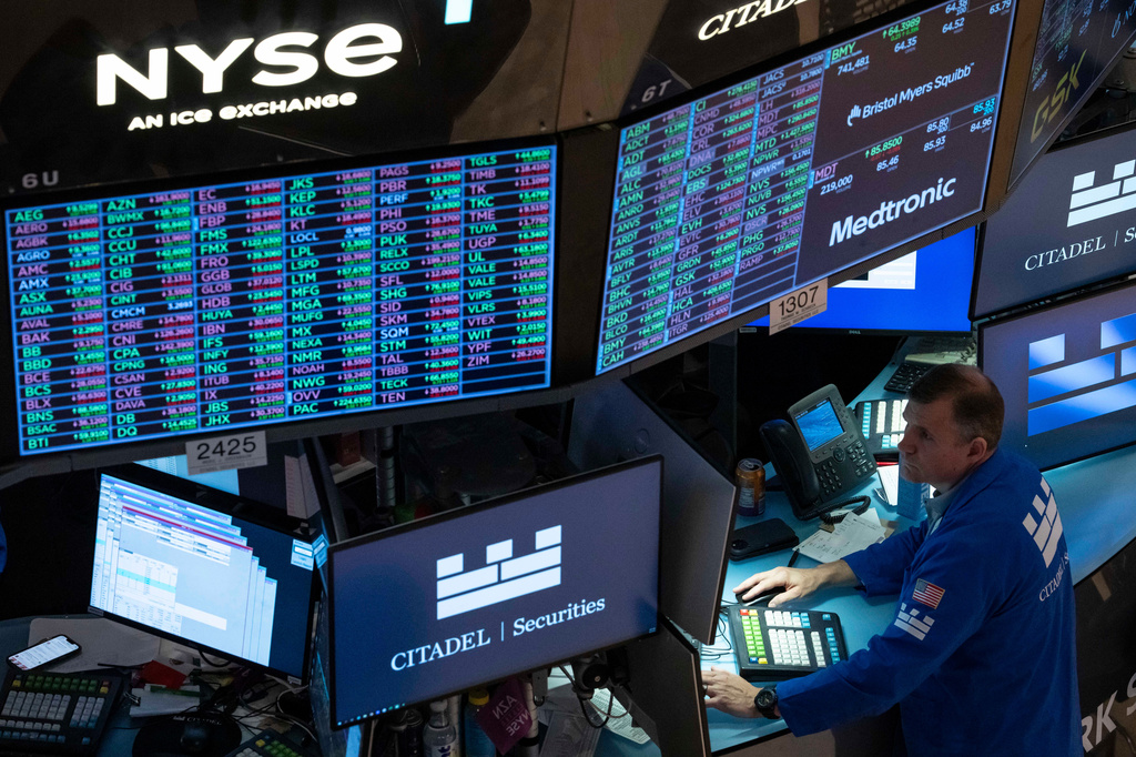 A screen shows stock prices on the floor of the New York Stock Exchange, Friday, Aug. 7, 2026, in New York. (AP Photo/Yuki Iwamura)