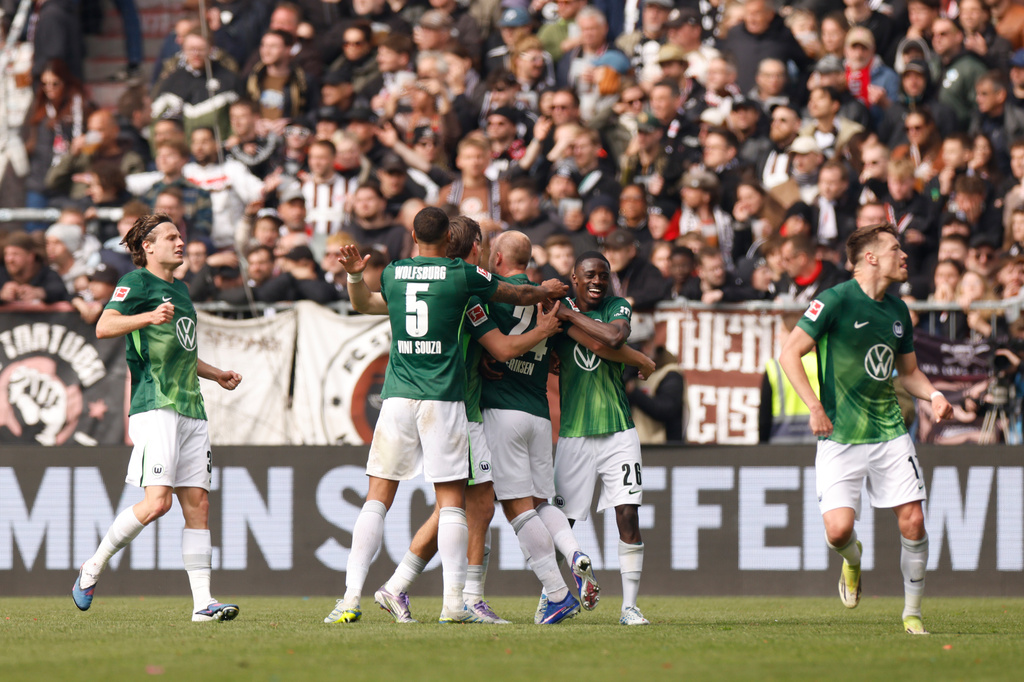 Wolfsburg's players celebrate after their second goal during the German Bundesliga soccer match between FC St. Pauli and VfL Wolfsburg in Hamburg, Germany, Saturday, May 16, 2026. (Christian Charisius/dpa via AP)