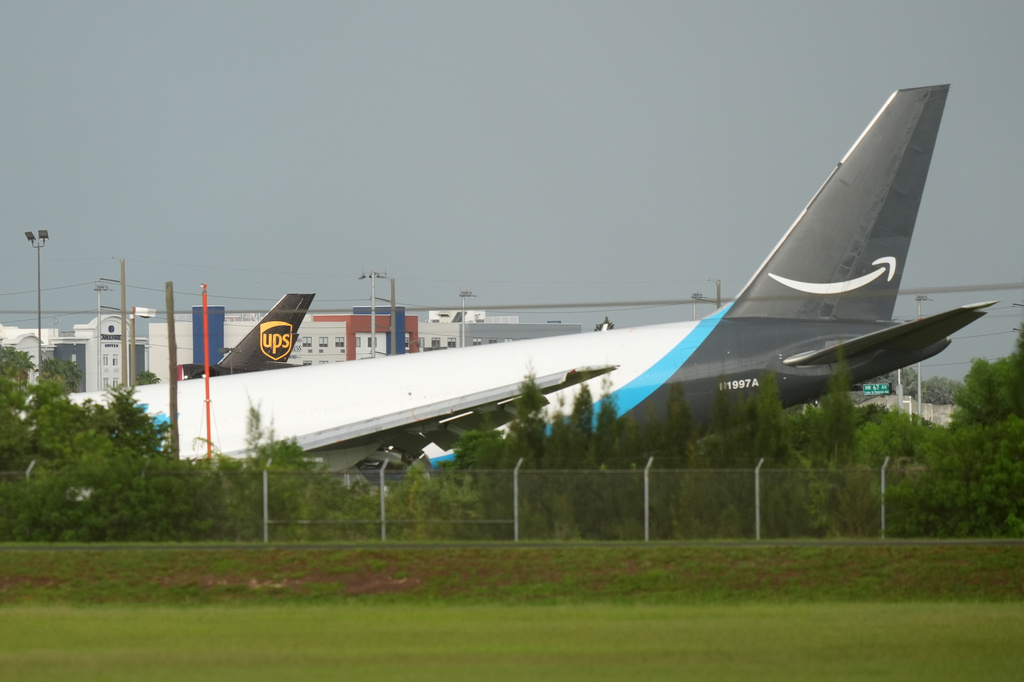 An Amazon cargo plane sits at the Miami International Airport (MIA) after it overshot the runway, Sunday, Sept. 6, 2026. (AP Photo/Lynne Sladky)