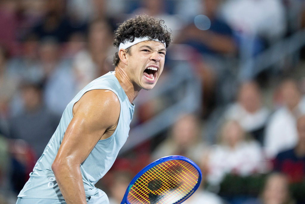Ben Shelton of the United States reacts during his match against compatriot Brandon Nakashima during the final tennis match of the National Bank Open in Montreal, Thursday, Aug. 13, 2026. (Christinne Muschi/The Canadian Press via AP)