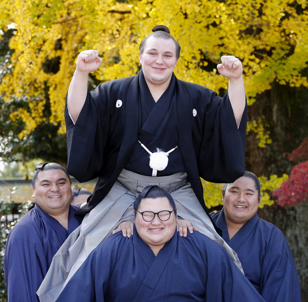 Ukrainian sumo wrestler Aonishiki, top, poses as he celebrates his promotion to the rank of ozeki in Kurume, Fukuoka prefecture, southern Japan Wednesday, Nov. 26, 2025. (Kyodo News via AP)