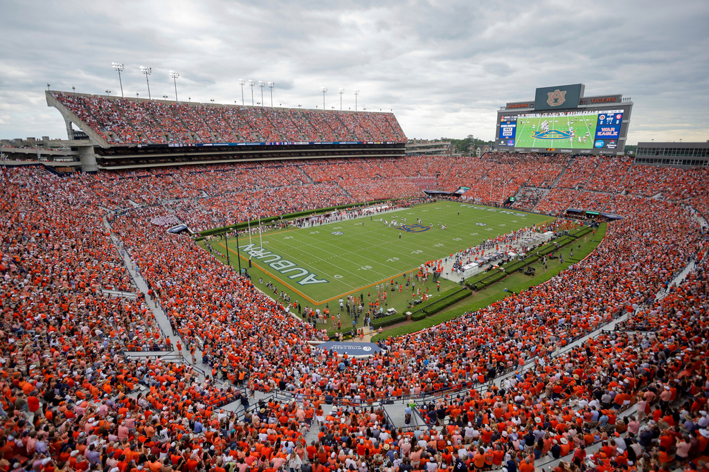 FILE - Fans file Jordan-Hare Stadium during the first half an NCAA football game between the Oklahoma and Auburn, Sept. 28, 2024, in Auburn, Ala. (AP Photo/Stew Milne, File)