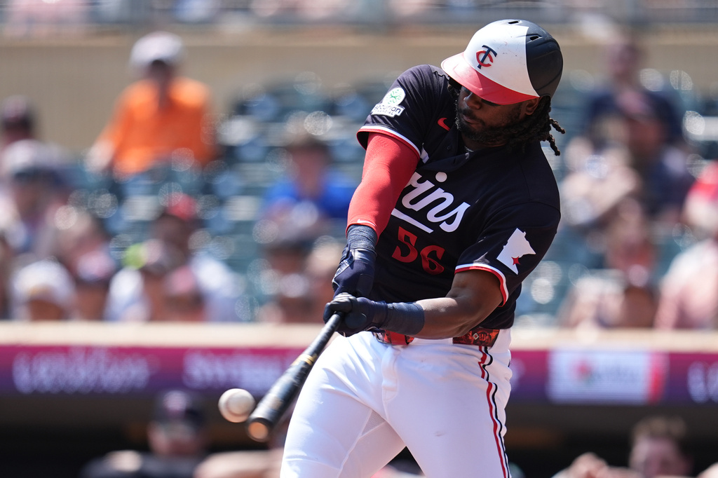 Minnesota Twins' Josh Bell (56) hits an RBI-single during the first inning of a baseball game against the Baltimore Orioles, Wednesday, Aug. 12, 2026, in Minneapolis. (AP Photo/Abbie Parr)