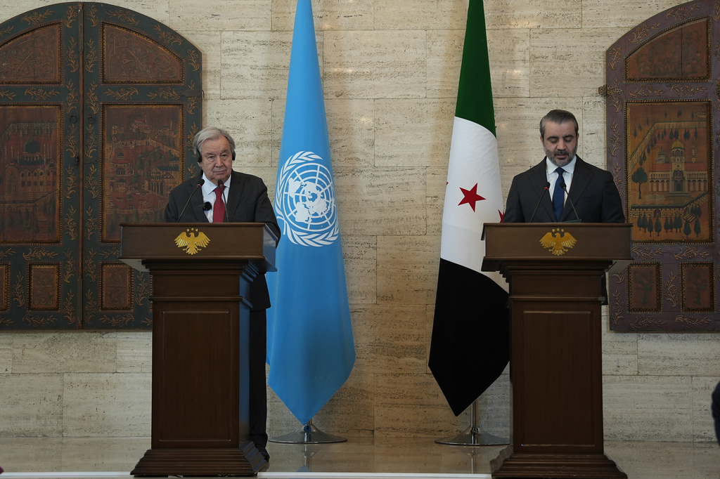 United Nations Secretary General Antonio Guterres, left, attends a joint press conference with Syrian Foreign Minister Asaad al-Shibani, in Damascus, Syria, Saturday, July 25, 2026. (AP Photo/Omar Albam)