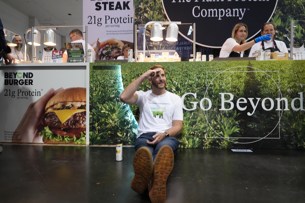Beyond CEO Ethan Brown, the company's founder, poses for a photo at his Beyond booth as the company is transitioning from Beyond Meat to just Beyond, to introduce a new line of sparkling plant‑protein drinks at the Natural Products Expo West 2026 at the Anaheim Convention Center in Anaheim, Calif., on Thursday, March 5, 2026. (AP Photo/Damian Dovarganes)