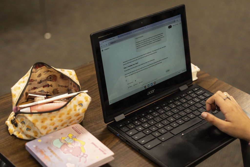 A student types a prompt into ChatGPT on a Chromebook during Casey Cuny's English class at Valencia High School in Santa Clarita, Calif., Wednesday, Aug. 27, 2025. (AP Photo/Jae C. Hong)