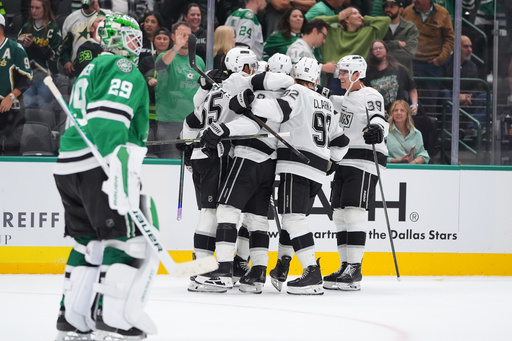 The Los Angeles Kings celebrate the winning goal by right wing Adrian Kempe (9) as Dallas Stars goaltender Jake Oettinger (29) skates off during overtime in an NHL hockey game Thursday, Oct. 23, 2025, in Dallas. (AP Photo/LM Otero) The Los Angeles Kings celebrate the winning goal by right wing Adrian Kempe (9) as Dallas Stars goaltender Jake Oettinger (29) skates off during overtime in an NHL hockey game Thursday, Oct. 23, 2025, in Dallas. (AP Photo/LM Otero)