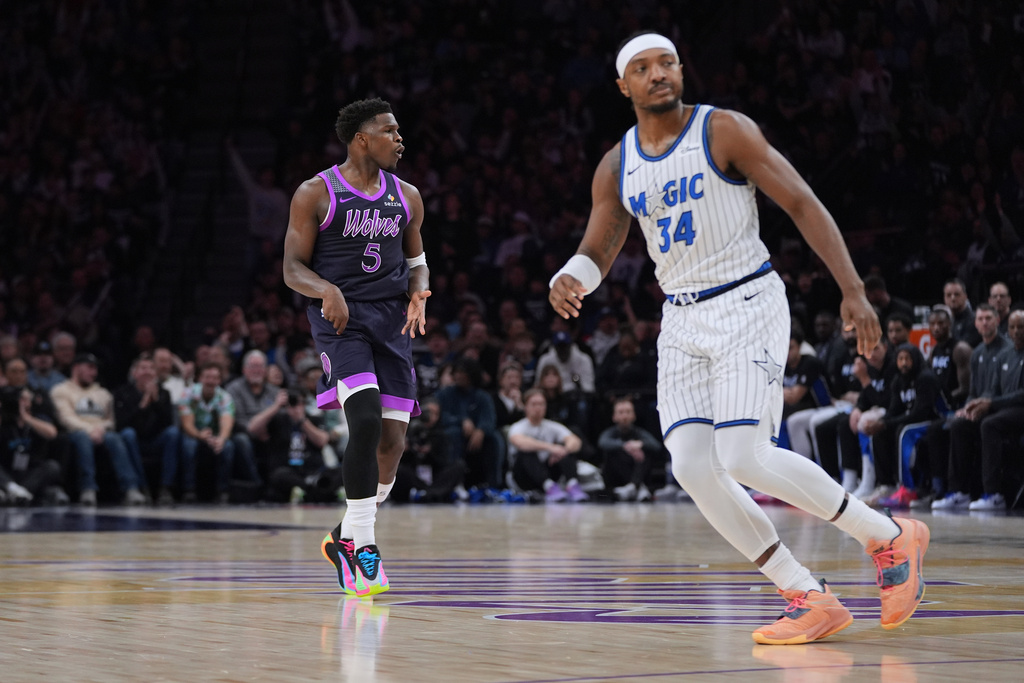Minnesota Timberwolves guard Anthony Edwards (5) celebrates after making a 3-point shot during the first half of an NBA basketball game against the Orlando Magic, Saturday, March 7, 2026, in Minneapolis. (AP Photo/Abbie Parr)