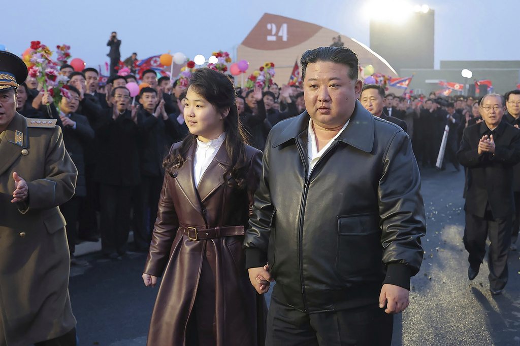 FILE - In this photo provided by the North Korean government, North Korean leader Kim Jong Un, center right, and his daughter attend a completion and operation ceremony of Kangdong Greenhouse Farm in Pyongyang, North Korea, March 15, 2024. Independent journalists were not given access to cover the event depicted in this image distributed by the North Korean government. The content of this image is as provided and cannot be independently verified. (Korean Central News Agency/Korea News Service via AP, File)