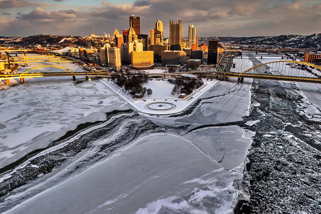 Ice covers the confluence of the Allegheny, left, Ohio, center, and Monongahela Rivers at the Point State Park in downtown Pittsburgh, Jan. 28, 2026. (AP Photo/Gene J. Puskar)