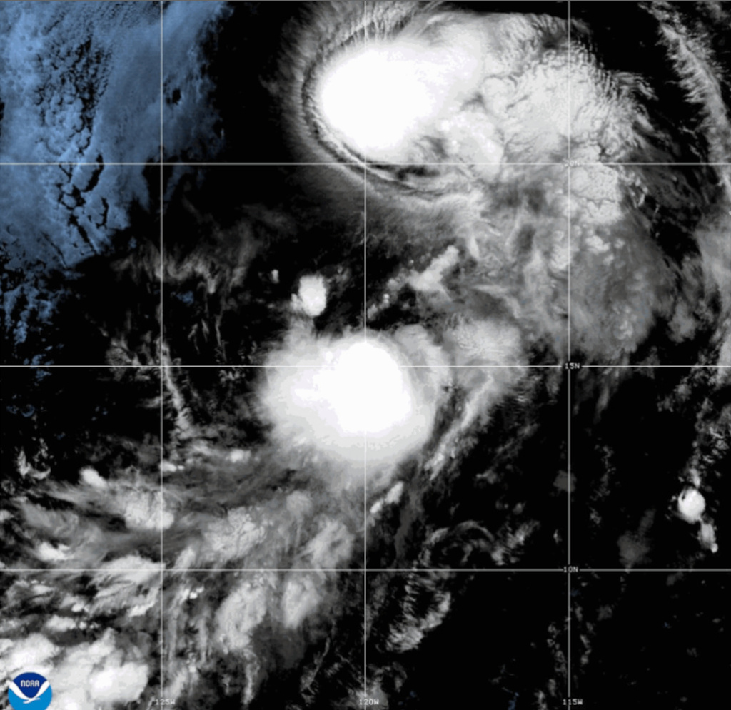 This satellite image released by NOAA shows the Tropical Storms Iselle, top, and Julio, bottom, over the Pacific Ocean, Tuesday, Aug. 25, 2026. (NOAA via AP)