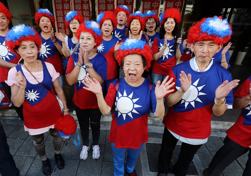People cheer with Taiwan's national flags suits during National Day celebrations in front of the Presidential Building in Taipei, Taiwan, Friday, Oct. 10, 2025. (AP Photo/Chiang Ying-ying) People cheer with Taiwan's national flags suits during National Day celebrations in front of the Presidential Building in Taipei, Taiwan, Friday, Oct. 10, 2025. (AP Photo/Chiang Ying-ying)